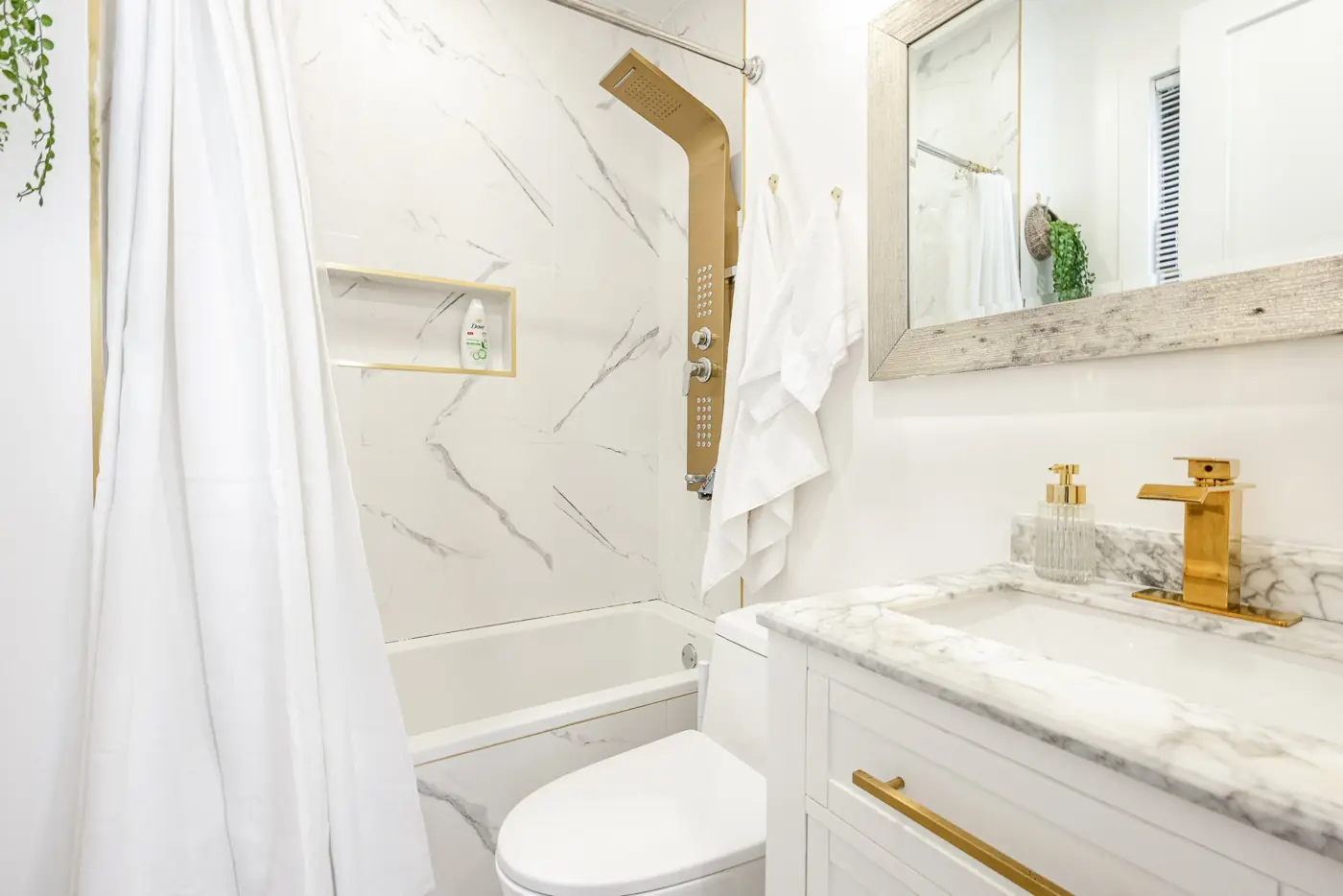 Marble bathroom with gold rain shower